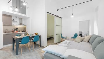 Standard Apartment, Multiple Bedrooms, 2 Bathrooms (Saro House) | Living area | 21-inch TV with cable channels