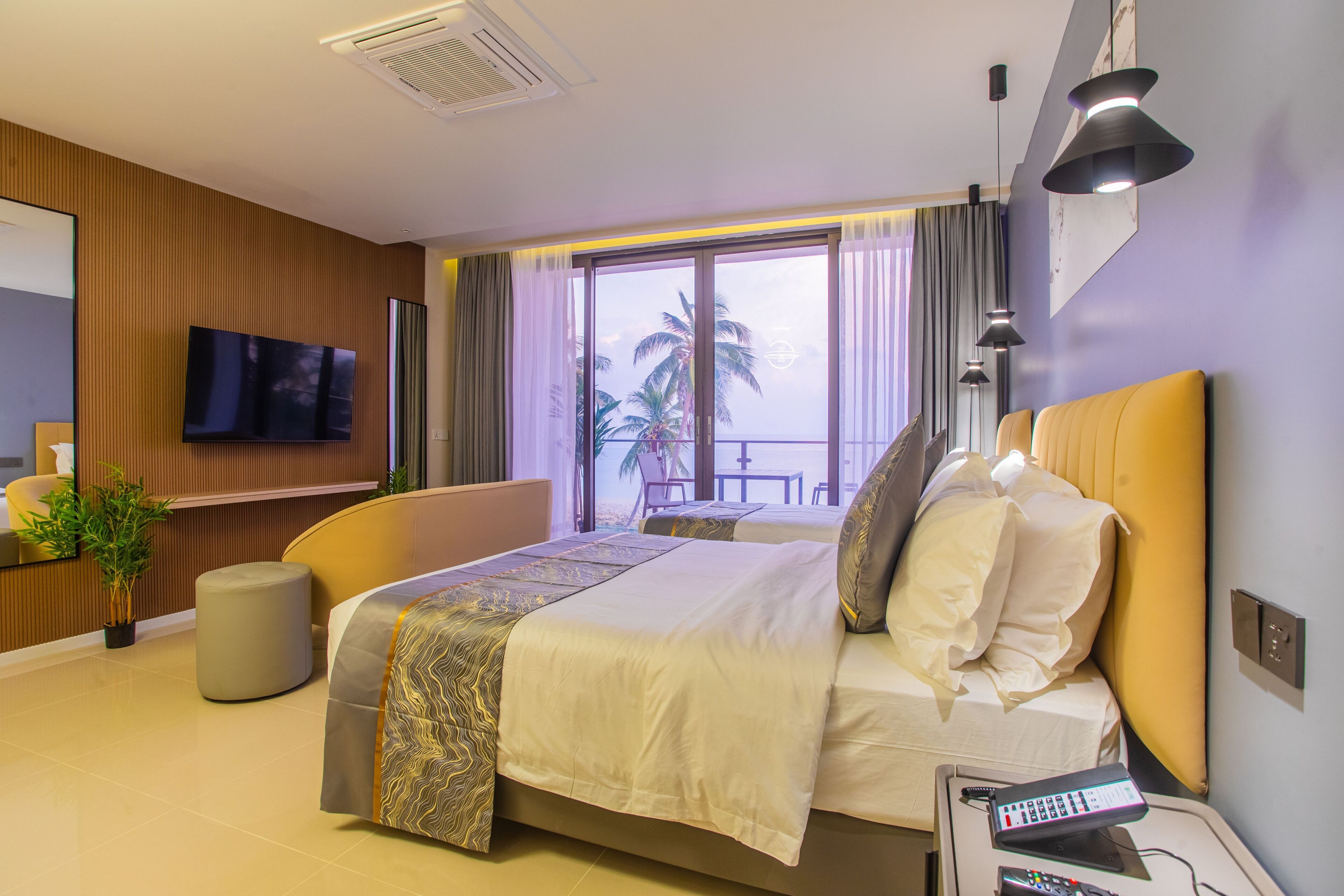 Deluxe Triple Room, Balcony, Sea View | Minibar, in-room safe, desk, laptop workspace