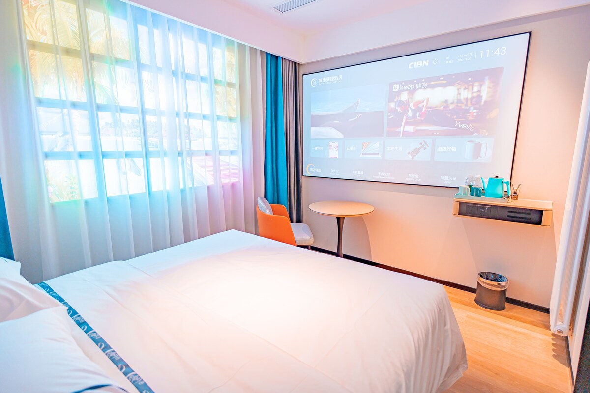 Premium bedding, memory-foam beds, desk, laptop workspace