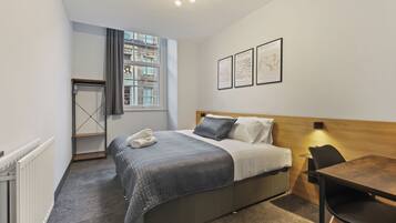 Signature Apartment | Desk, laptop workspace, blackout curtains, soundproofing