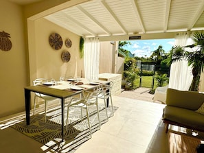 Outdoor dining - 2-bedroom condo in soothing Orient Bay. (Orient bay)