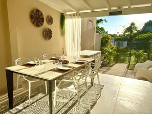 Outdoor dining - 2-bedroom condo in soothing Orient Bay. (Orient bay)