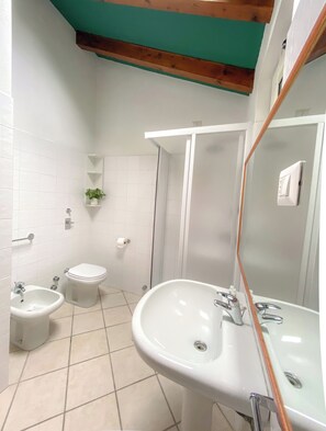 Superior Triple Room, Balcony | Bathroom | Shower, hair dryer, towels, soap - RRRapido Hotel (Sesto San Giovanni)