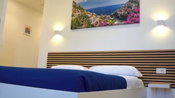 Quadruple Room, Private Bathroom, Mountain View | In-room safe, laptop workspace, blackout curtains, free WiFi