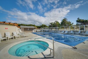 A swimming pool with a diving board, lounge chairs, and a covered area with a roof. - Beach Access & Community Perks! Westport Hideaway (Westport)