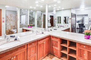 A modern bathroom with two sinks, wooden cabinets, and a large mirror. - 3 Mi to Vail Ski Resort! Mtn-view Haven w/ 2 Decks (Vail)