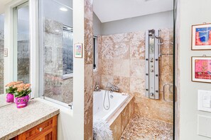 A bathroom with a glass shower enclosure, a bathtub, and a vanity with a pink vase. - 3 Mi to Vail Ski Resort! Mtn-view Haven w/ 2 Decks (Vail)