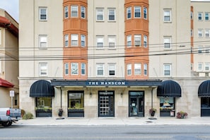 A building with a sign reading 'THE HANSCOM' at the entrance. - Walk to Beach & Music Pier! Condo in Ocean City (Ocean City)