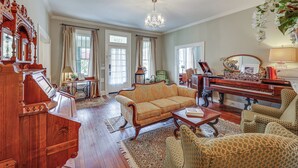 A spacious living room with a grand piano, a sofa, and patterned armchairs. - Great for Gatherings! Gem < 1 Mi to Dtwn Texarkana (Texarkana)