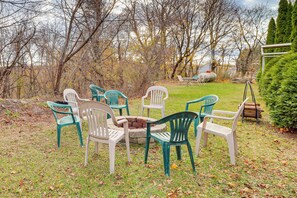 A garden with outdoor seating and a fire pit. - 4 Mi to Mauch Chunk Lake: Spacious Apt w/ Bar! (Summit Hill)