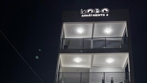 A multi-story building with a sign reading "LOBO APARTMENTS 2". - Lobo studio apartments (Serrekunda)