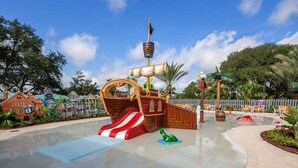 A pirate-themed play area with a slide, a ship-shaped play structure, and a small green sea creature. - 3 Beds 3 Baths Cozy Town Home 3 Bedroom Townhouse (Davenport)