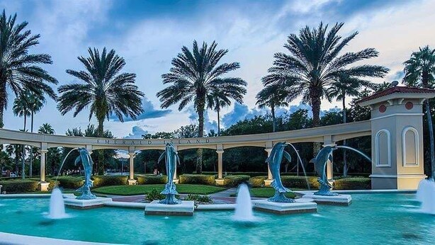 A pool area with multiple fountains and palm trees. - Southern Comfort Private Pool/spa Near Disney! 6 Bedroom Villa (Kissimmee)