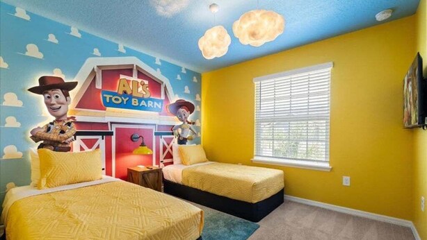 A room with two beds, a toy barn mural, and a window with blinds. - The Sun Factory Home With Private Pool! 5 Bedroom Villa (Davenport)