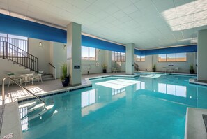 An indoor swimming pool with multiple lanes, a staircase, and seating areas. - Marigot Beach 403 2bedroom Oceanfront (Ocean City)