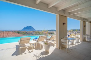Seasonal outdoor pool, pool umbrellas, pool loungers
