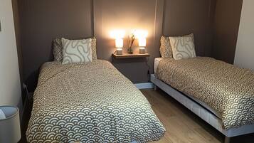 Iron/ironing board, travel crib, free WiFi, bed sheets