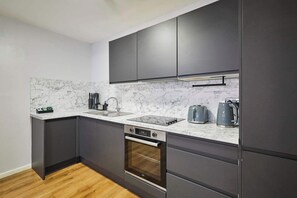 Fridge, oven, stovetop, cookware/dishes/utensils - Host & Stay | Apartment 1, Stanley Street (Liverpool)