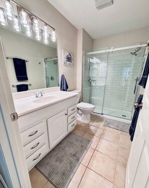 Shower, hair dryer, towels, soap