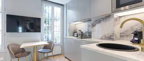 Fridge, microwave, coffee/tea maker, toaster