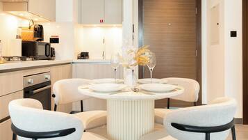 Deluxe Apartment, Balcony, Pool View | In-room dining