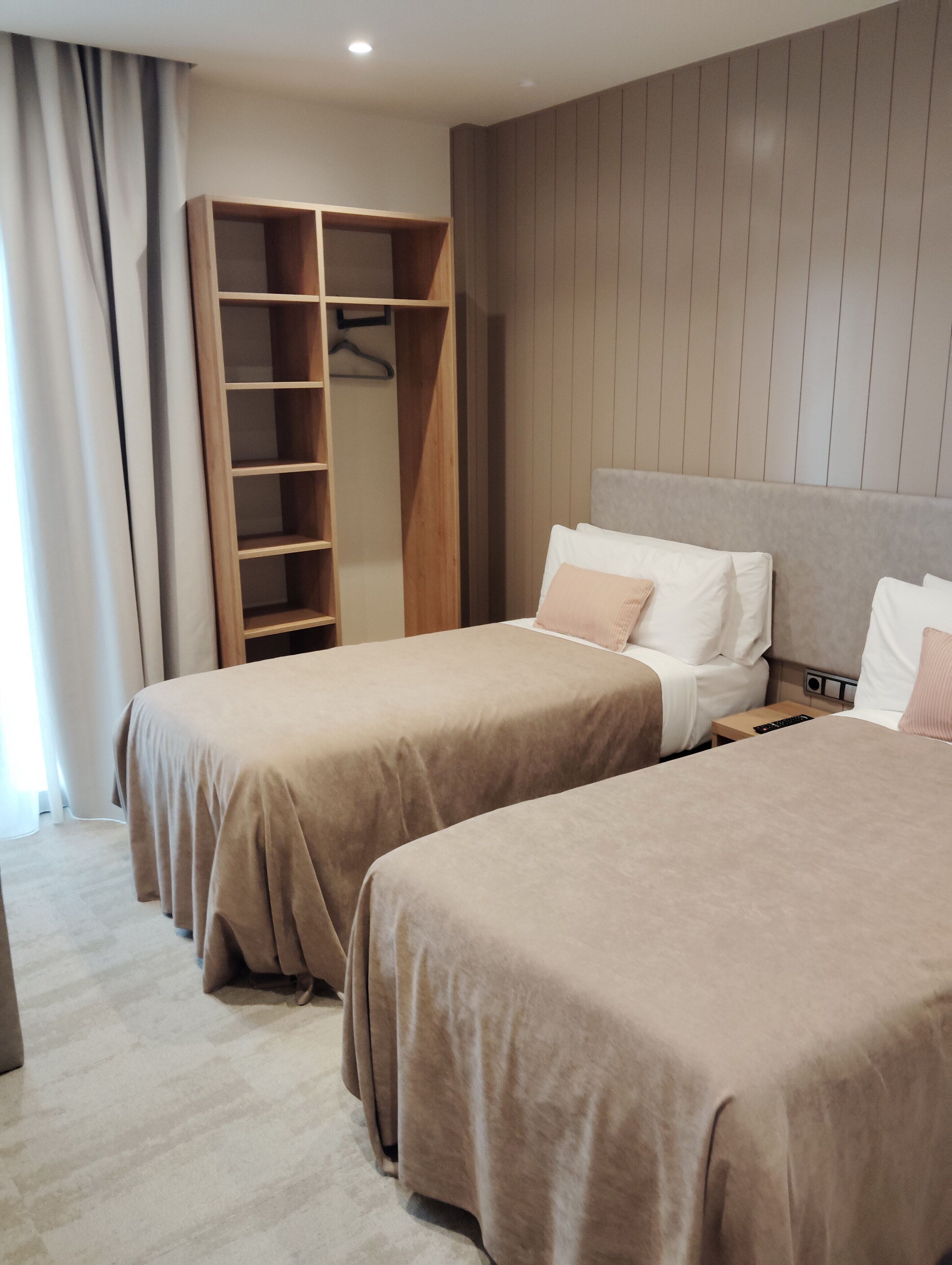Premium bedding, desk, laptop workspace, soundproofing