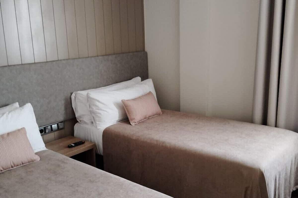 Premium bedding, desk, laptop workspace, soundproofing