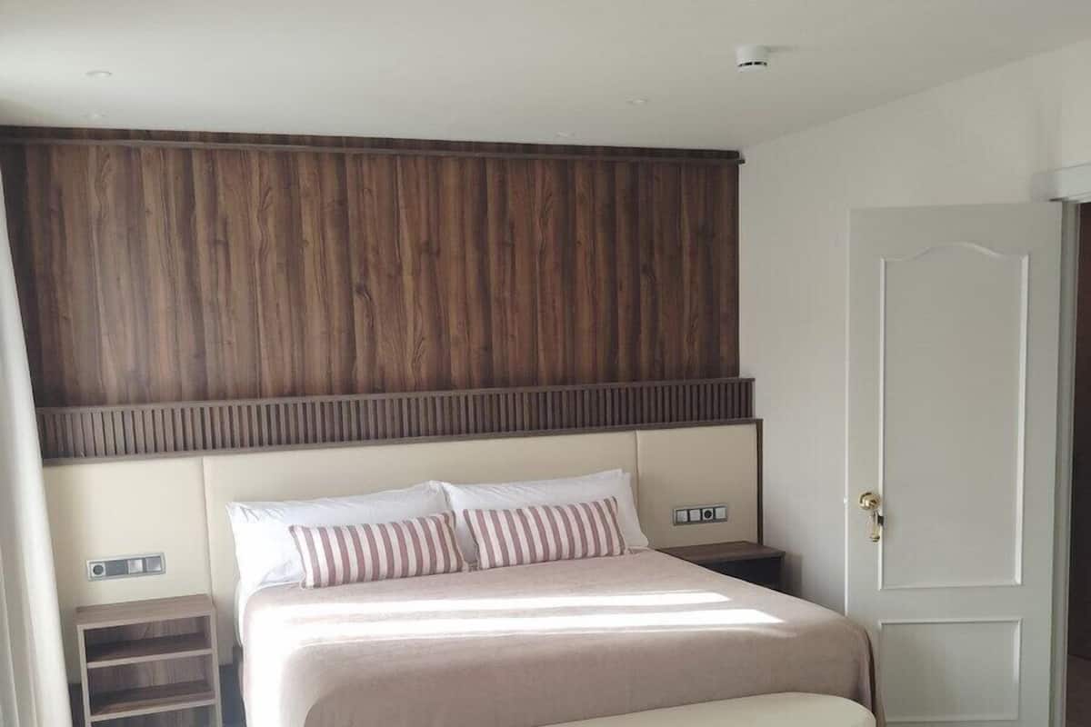 Premium bedding, desk, laptop workspace, soundproofing