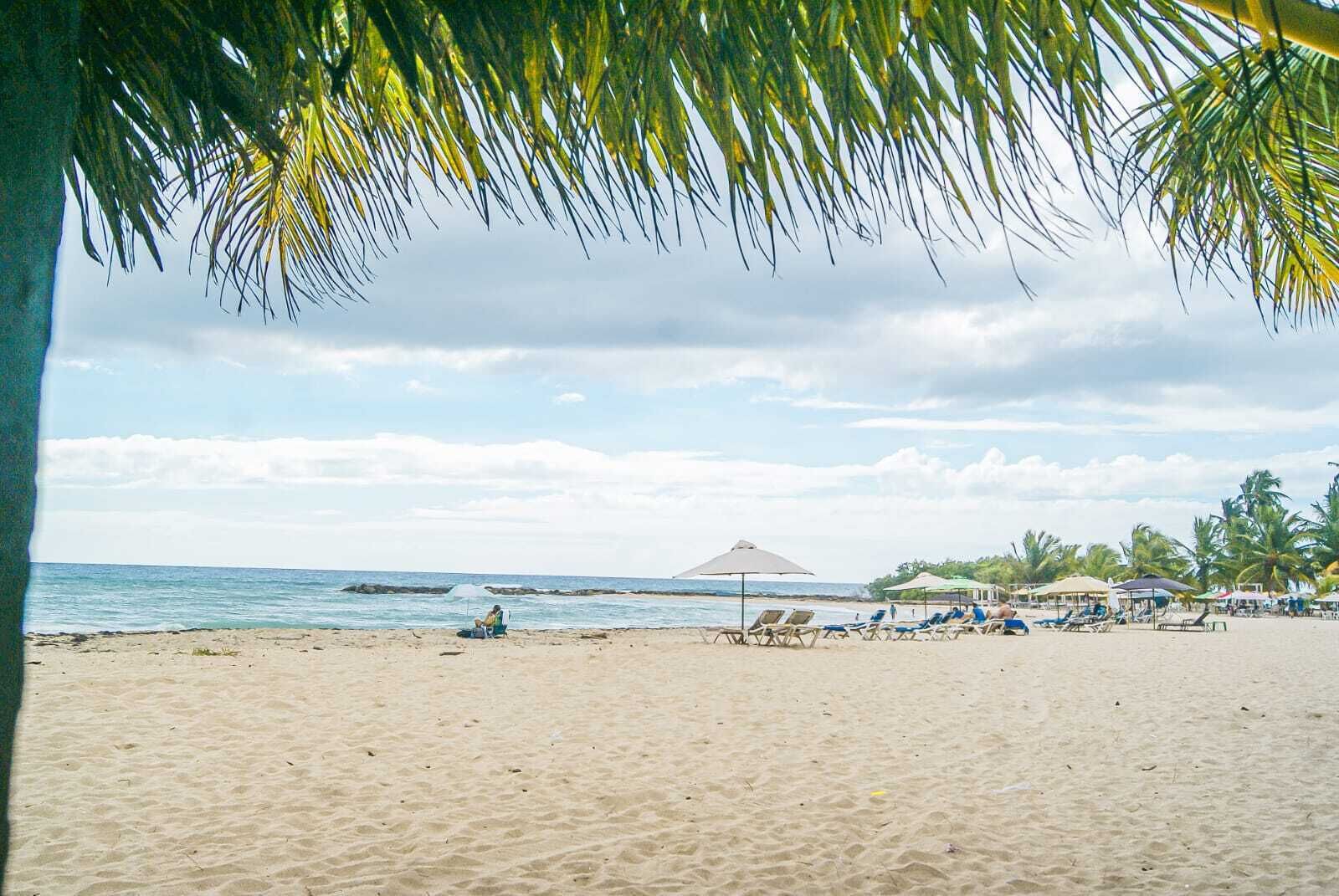 On the beach, white sand, free beach cabanas, beach umbrellas
