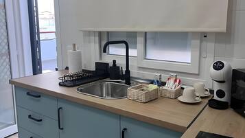 Fridge, microwave, stovetop, coffee/tea maker