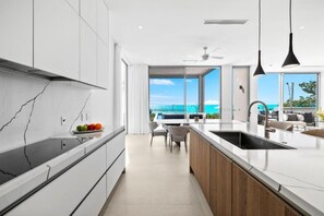 Fridge, microwave, oven, stovetop - Experience Paradise in Modern Room w/ Balcony Views of Turquoise Seas (Long Bay Hills)