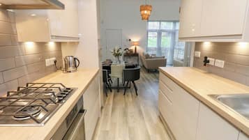 Fridge, microwave, dishwasher, cookware/dishes/utensils