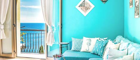 Deluxe Apartment, Ocean View, Beachfront | Living area | 40-inch Smart TV with digital channels, computer monitors, printers