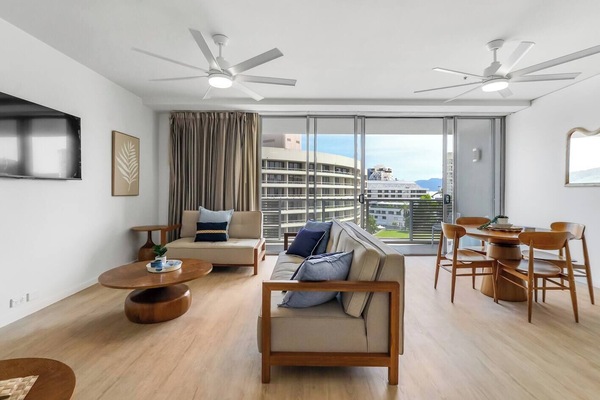 Full-height glass doors fill the lounge with natural light and open to sweeping views, creating an inviting indoor-outdoor flow perfect for unwinding after a day by the water.