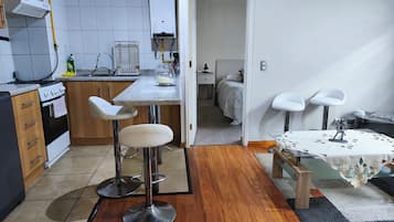 Family Apartment, 2 Bedrooms, Patio, City View | Living area | Flat-screen TV