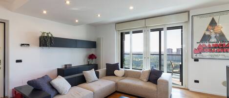 Comfort Double Room, City View | Living area | 65-inch Smart TV with digital channels