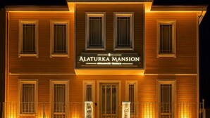 A multi-story building with a sign reading 'ALATURKA MANSION.' - alaturka mansion (İstanbul)