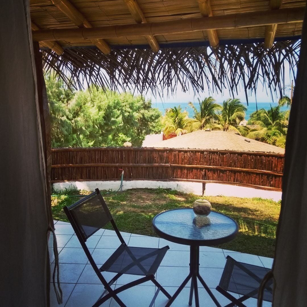 Suite Deluxe, vista parcial al mar | Terraza o patio