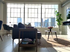 Living area - Highrise Condo . Skyline Views . Trendy DTLA (Los Angeles)