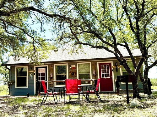 The Hitchin' Post Cabin- Texas Hill Country Western-themed cabin for 4 in the woods near Kerrville & Fredericksburg