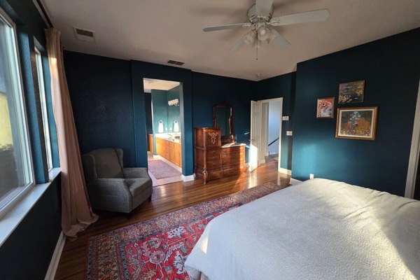 Primary bedroom with king bed and high-end linens