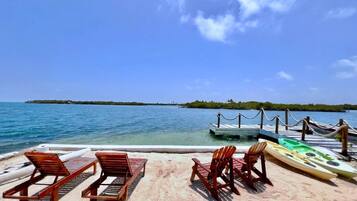 On the beach, white sand, free beach cabanas, sun loungers