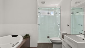 A modern bathroom with a glass-enclosed shower, a freestanding bathtub, and a toilet. - Bayleaf Terrace - A stylish period home in Hawthorn, steps from Glenferrie Road (Hawthorn)