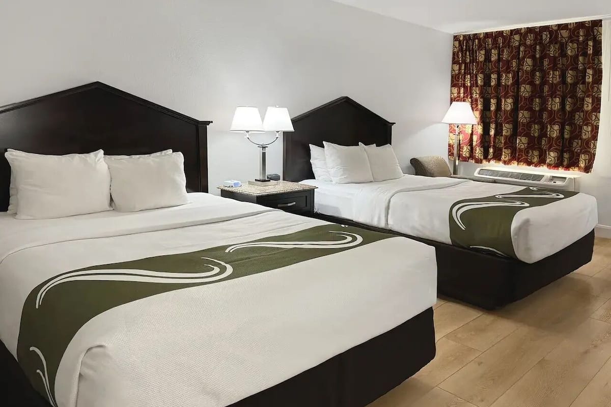 Desk, laptop workspace, blackout curtains, iron/ironing board