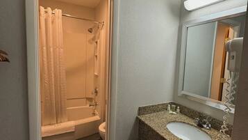 Separate bathtub and shower, hair dryer, towels, soap