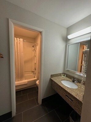 Separate bathtub and shower, hair dryer, towels, soap