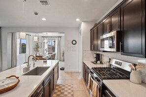Fridge, microwave, oven, stovetop - Spacious  4BR & 3BA Near Luke AFB, State Farm Stadium & Desert Diamond Arena (Glendale)