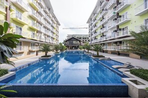 Condo, Accessible, Balcony | Pool | Outdoor pool - Stylish Condo 3-minutes to Airport, Poolview at Amani Grand Resort Residences (Lapu-Lapu)