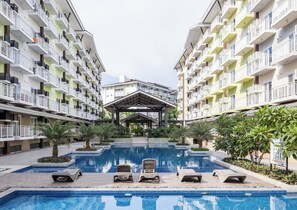 Condo, Accessible, Balcony | Pool | Outdoor pool - Stylish Condo 3-minutes to Airport, Poolview at Amani Grand Resort Residences (Lapu-Lapu)