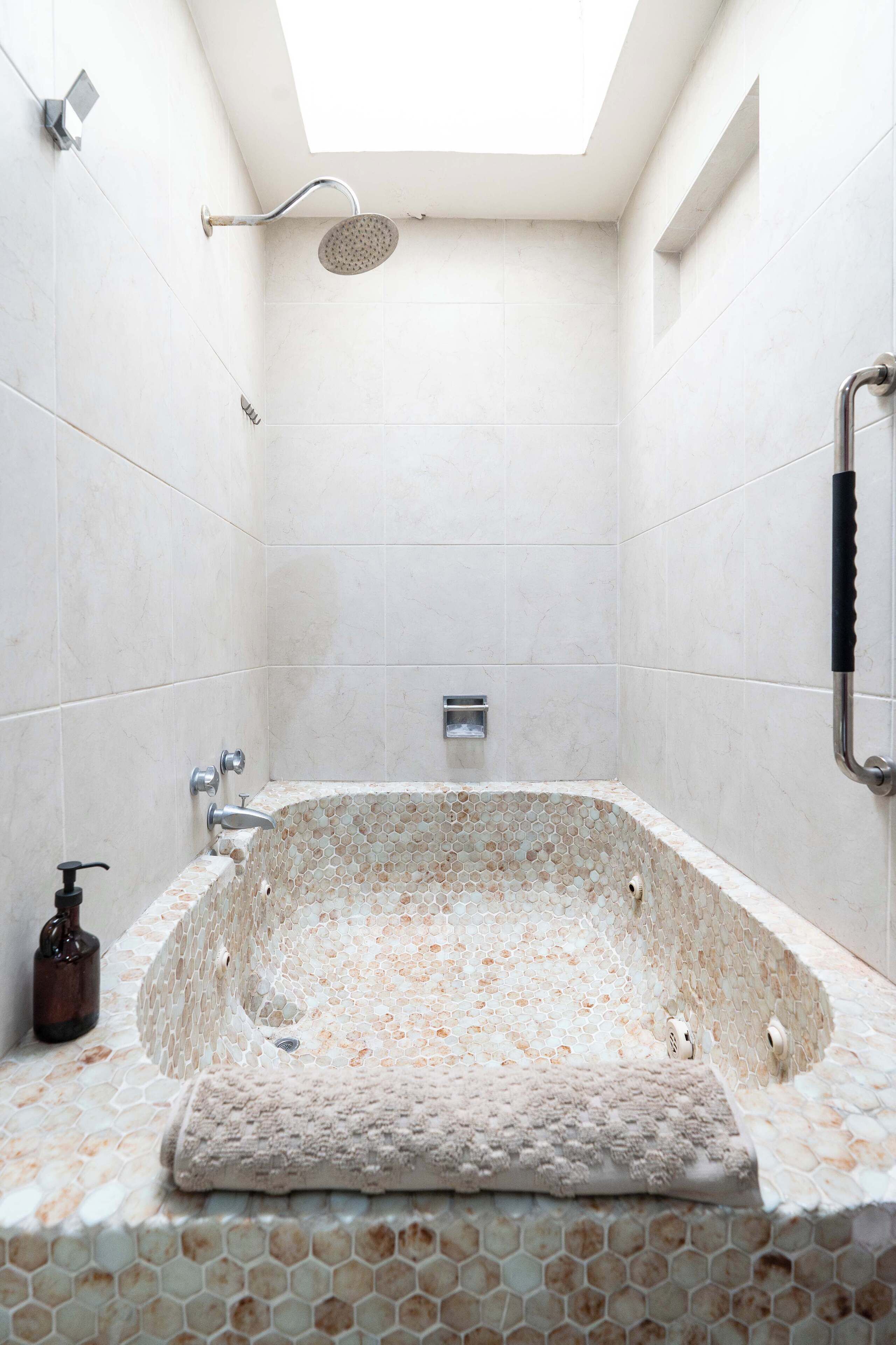 Shower, hair dryer, towels, shampoo